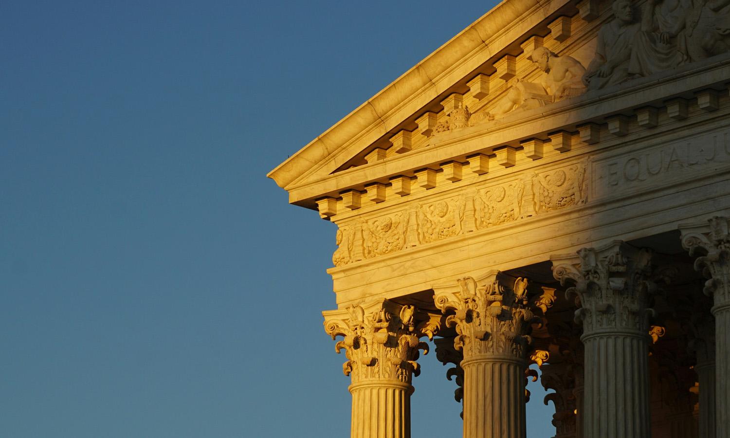 The US Supreme Court building at sunset