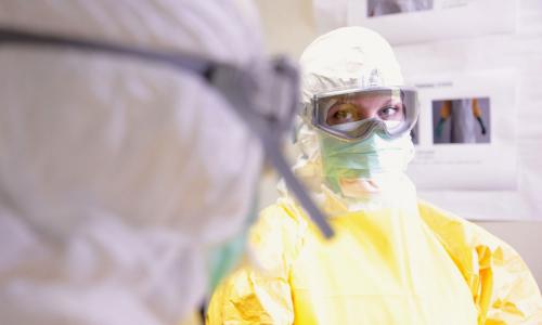 Scientists in hazmat suits