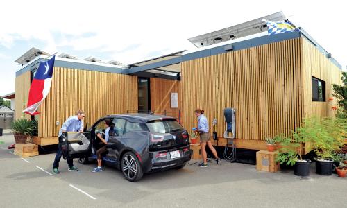 Smart home with electric car in driveway