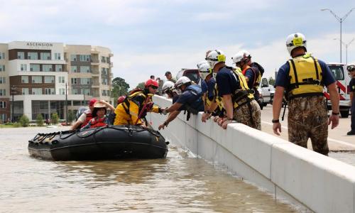 Raft rescuing flood victims in Houston, TX