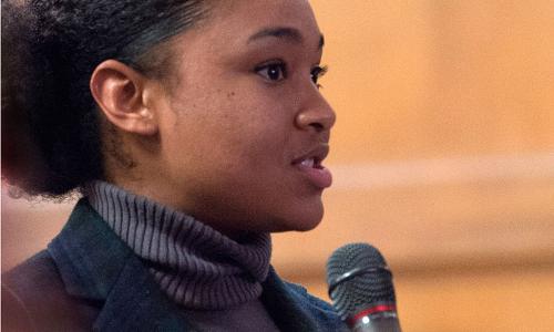 Woman speaking into microphone