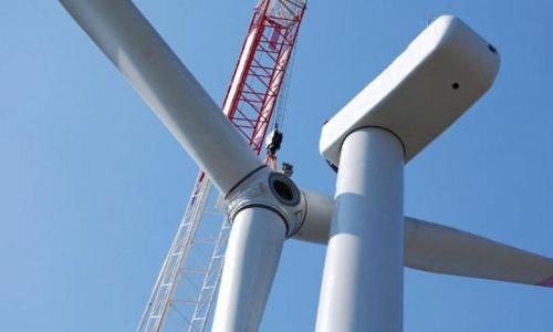 Wind turbine blades installed by a crane