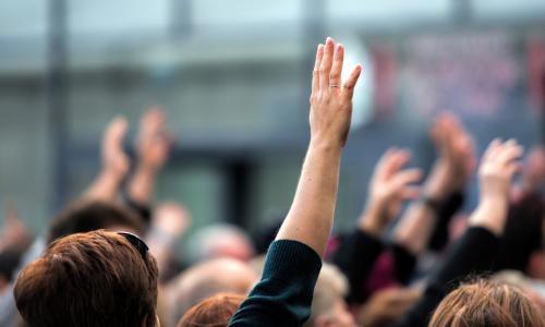 People raising their hands