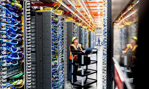 A worker inside of a data center.