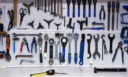 tools on a white pegboard