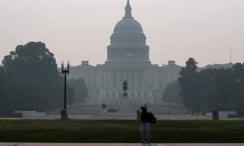 The US Capitol building behind a haze of wildfire smoke.